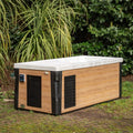 Modern Breeze ice bath with wooden panels and current system in outdoor garden setting - Passion Ice Baths Collection