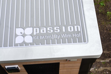 Modern white Breeze ice bath lid with Passion Ice Baths logo and ribbed design detail shown in outdoor setting - Ice baths by Passion Ice Baths