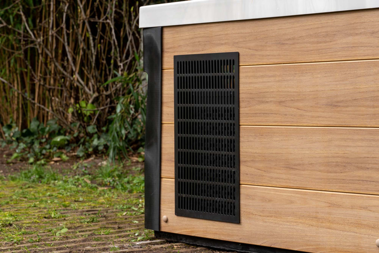 Modern Breeze ice bath with black ventilation panel on wood-grain exterior panel, showcasing current system - Passion Ice Baths