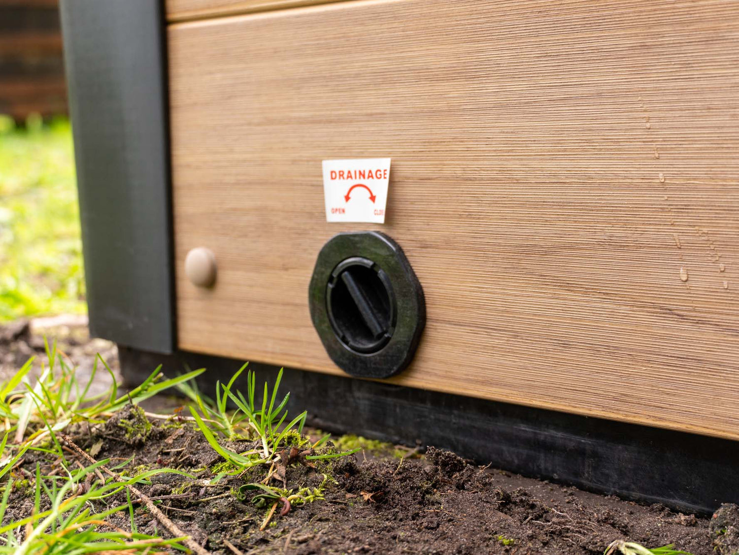 Modern drainage system on Breeze Ice Bath with Current, featuring wood panel exterior and black drain valve - Passion Ice Baths Collection