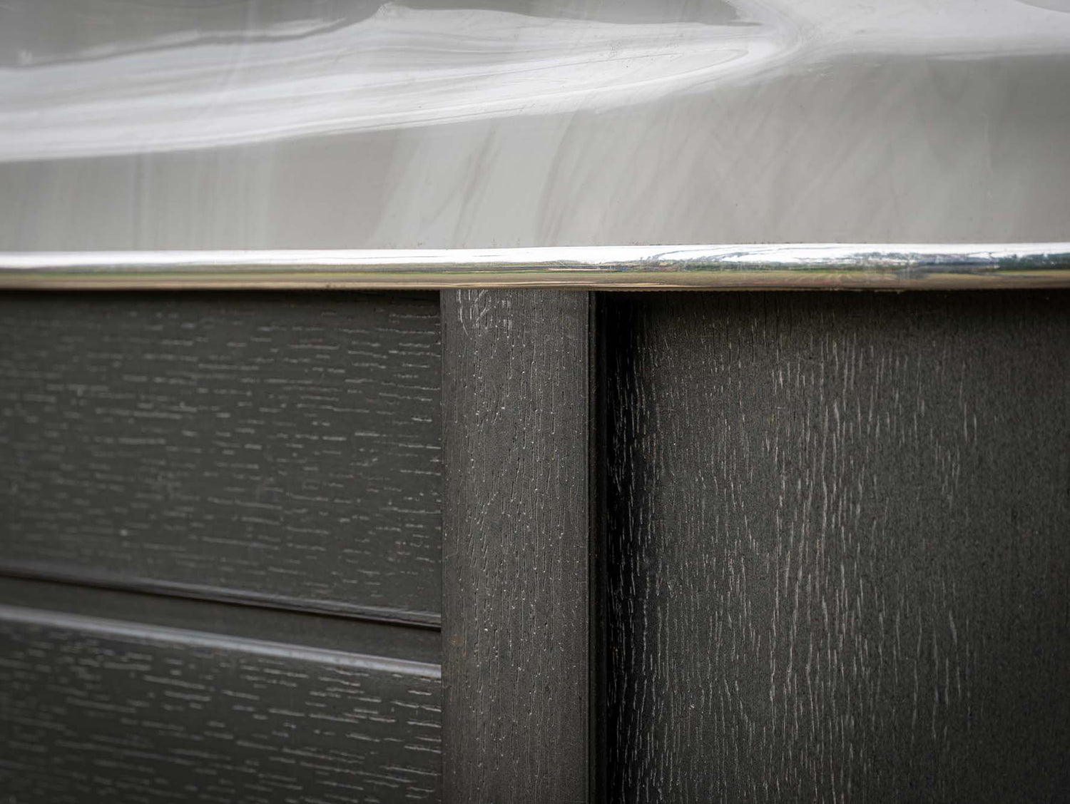 Close-up detail of Elevate ice bath's premium textured exterior panel with metallic trim - by Passion Ice Baths