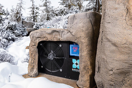 Rock-inspired outdoor ice bath 'Faith' with integrated cooling system nestled in snowy winter landscape - Passion Ice Baths Ice bath collection