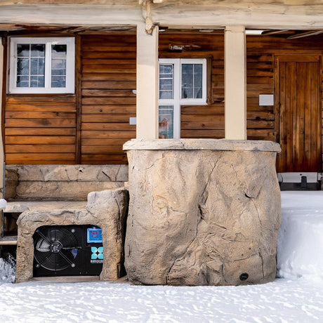 Faith rock-inspired ice bath with chiller unit against rustic wood cabin exterior by Passion Ice Baths Ice baths