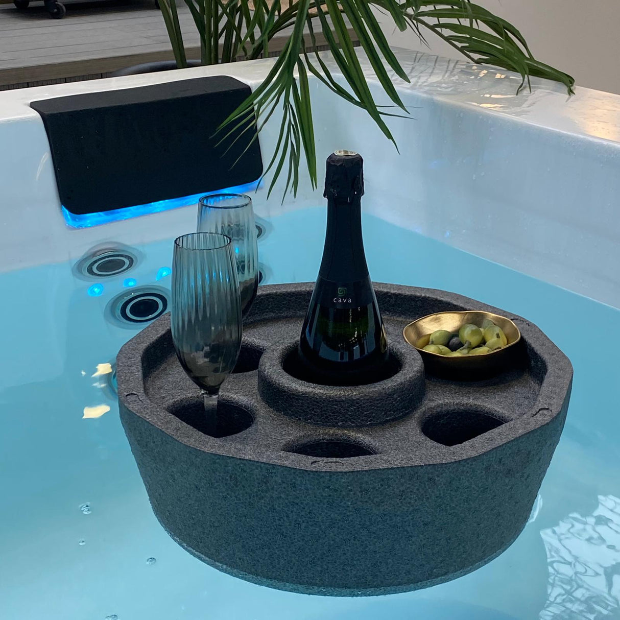 Floating bar with six glass holders in spa water, featuring champagne bottle and snacks - Passion Spas Accessories Mini bar
