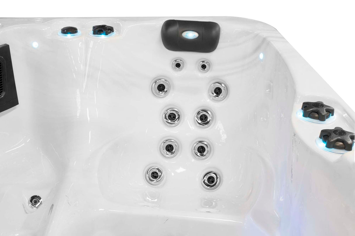 Renew 3-person hot tub interior showing ergonomic jet layout with hydrotherapy massage system in white acrylic - Passion Spas Pure Collection