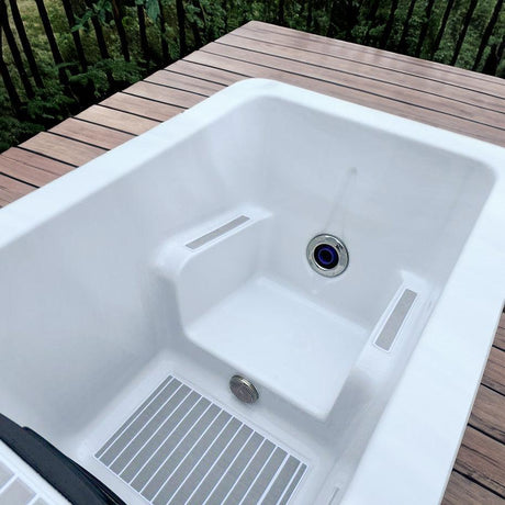 Breeze Ice Bath with Current featuring white interior, drain system and textured bottom on wooden deck - Passion Ice Baths Ice baths