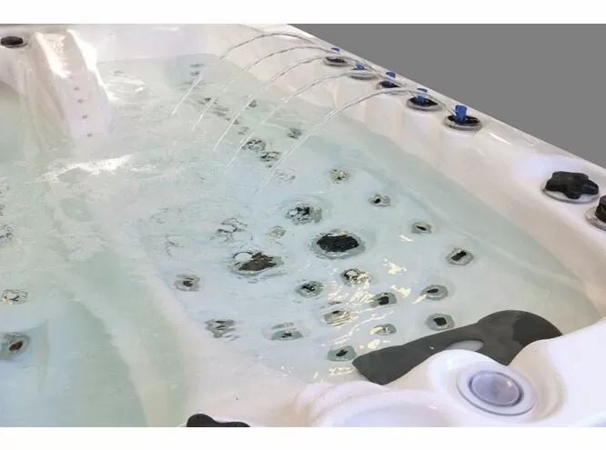 Euphoria spa interior showing multiple hydrotherapy jets and crystal clear water in white acrylic shell - Passion Spas Exclusive Collection