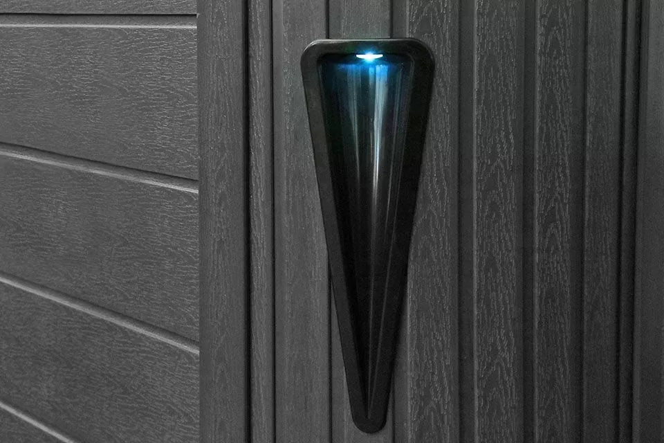 Black wall-mounted waterfall feature with blue LED lighting for Pleasure spa by Passion Spas - Signature Collection Hot Tubs