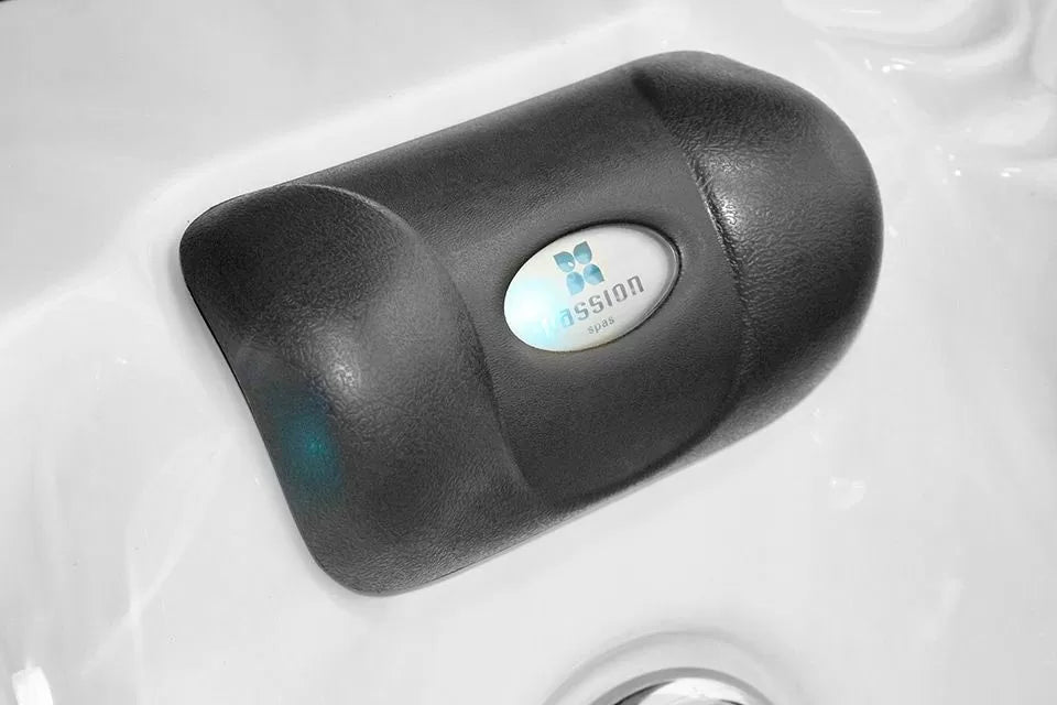 Luxury headrest with Passion Spas logo on Pleasure hot tub, featuring ergonomic design and black cushioning - Signature Collection