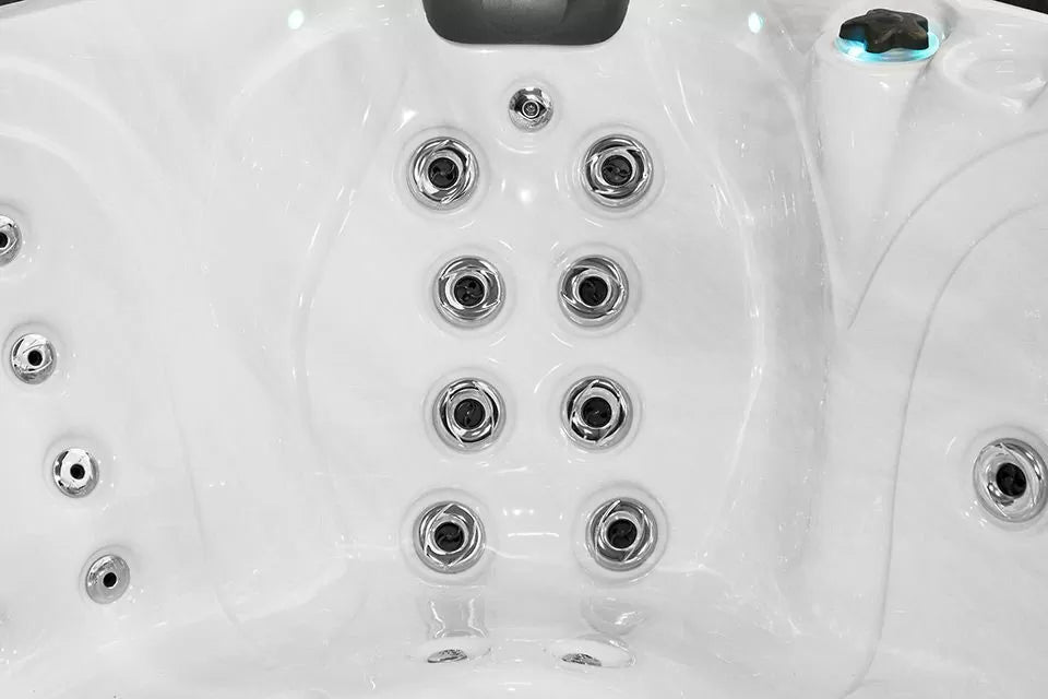 Pleasure hot tub interior showing premium jet configuration in white shell with chrome massage jets - Passion Spas Signature Collection
