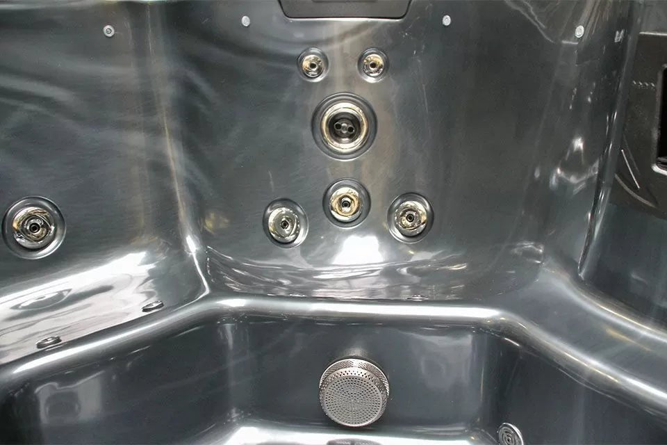 Interior detail of Refresh spa showing therapeutic jets and stainless steel finish in Passion Spas Pure Collection 5-person hot tub