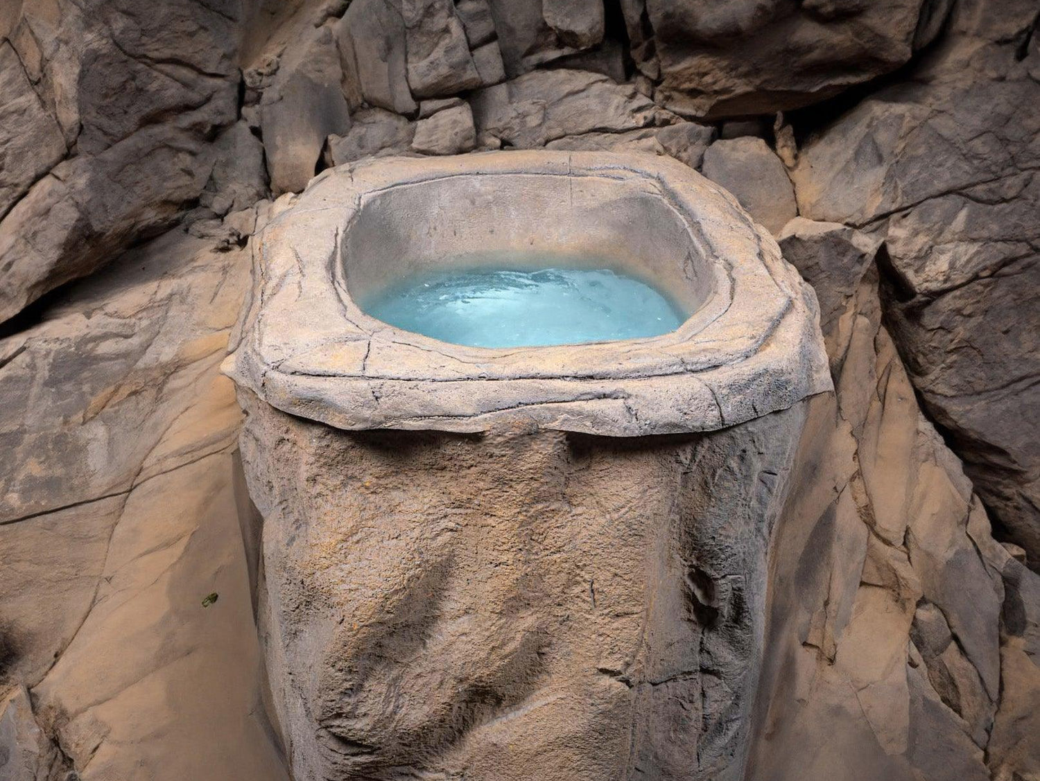 Faith rock-inspired ice bath with blue water in stone-textured design, showcasing natural aesthetics - Passion Ice Baths Collection