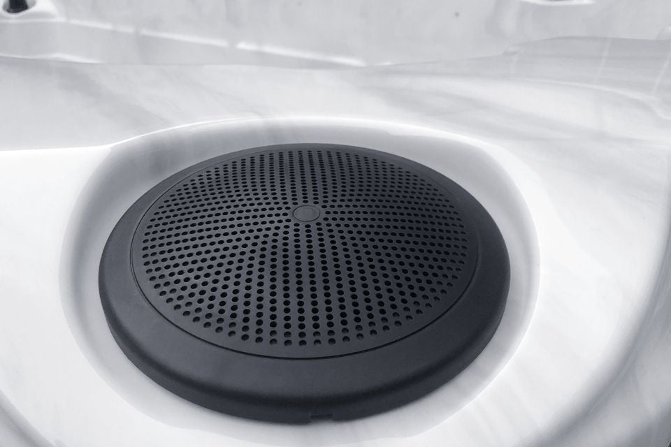 Black round speaker grill detail in white Activity 2 Deep swim spa by Passion Spas - Sport collection, Swim spas